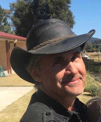 Smirking Gary with black leather stock hat